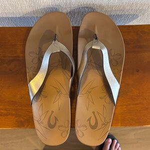 OLUKAI KIPE’A Leather Beach Sandals in Bronze.